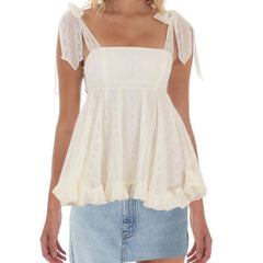 White blouse with sheer sleeves worn by a person 