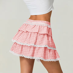 Pink checkered skirt with lace trim worn by a person