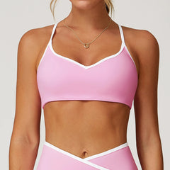 Person wearing a pink sports bra and leggings -close-up