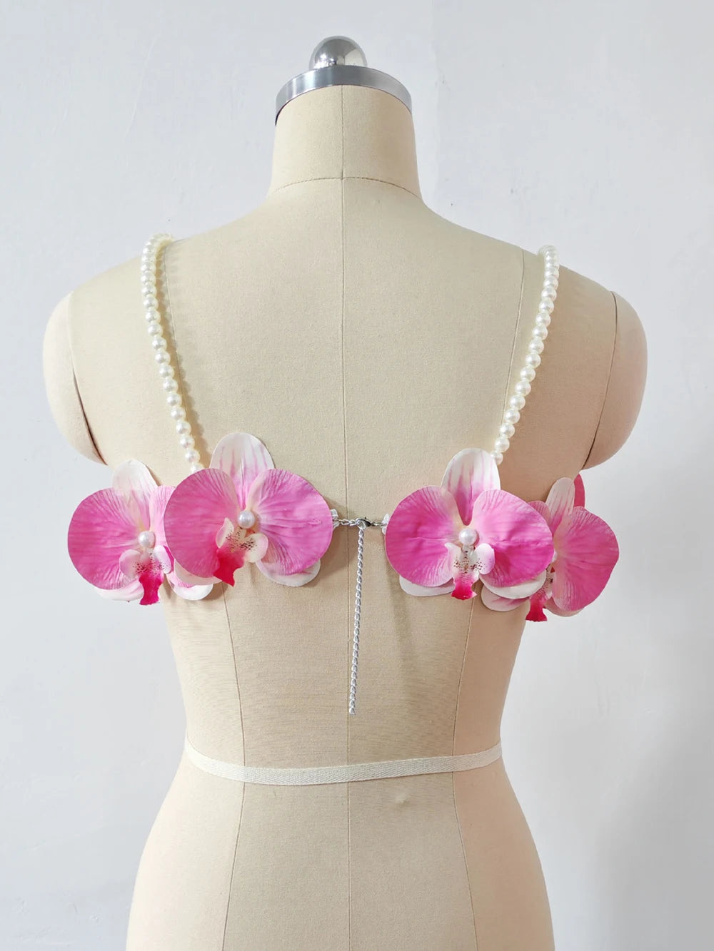 Women's pink 3D orchid pearl strap crop top.

