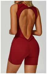 Red open-back romper worn by a person - back