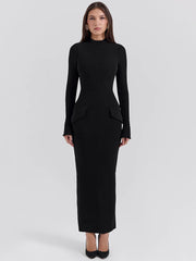 A woman wearing a flattering black maxi dress with a mock neck and a flowing silhouette, ideal for a special occasion.