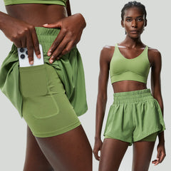 Green athletic outfit with sports bra and shorts- pocket details
