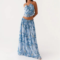 Woman wearing a blue floral two-piece outfit on a white background