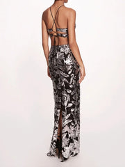Black and white floral dress with a high slit on a white background