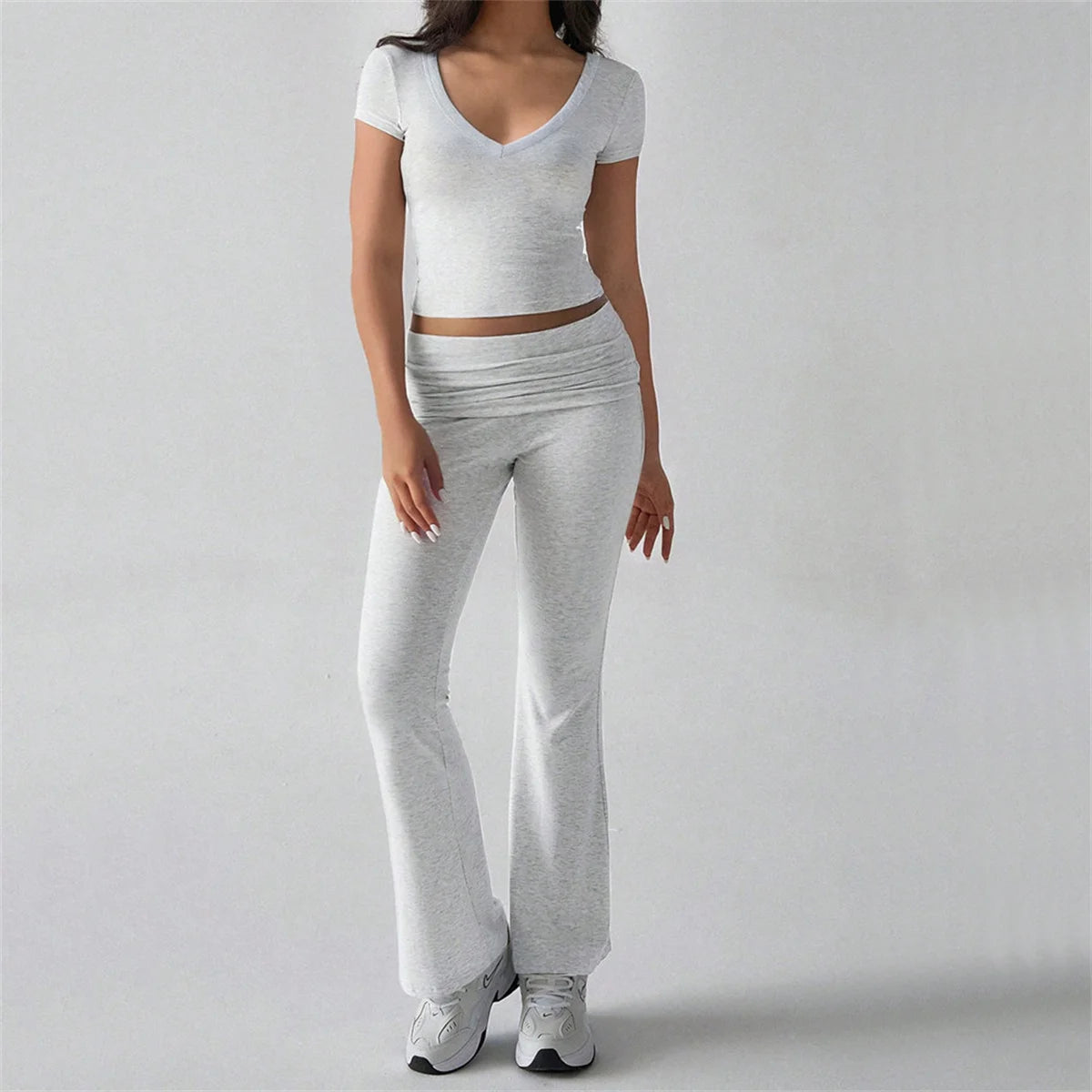 Person wearing a gray long pant suit