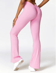 Pink flared pants worn by a person- side view