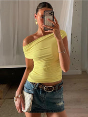 A one-shoulder crop top with a drawstring and ruched detailing.