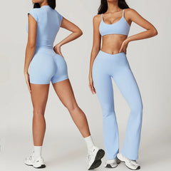 Woman wearing a light blue athletic outfit - front and back, short and long leggings