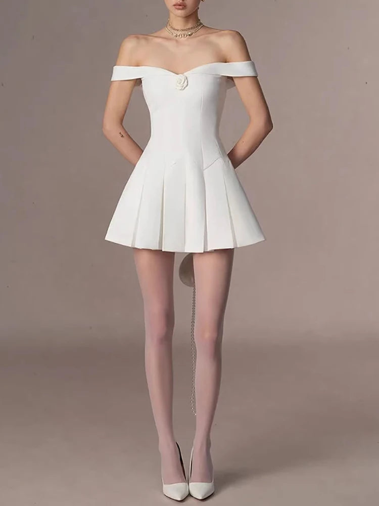 White off-shoulder dress worn by a model 