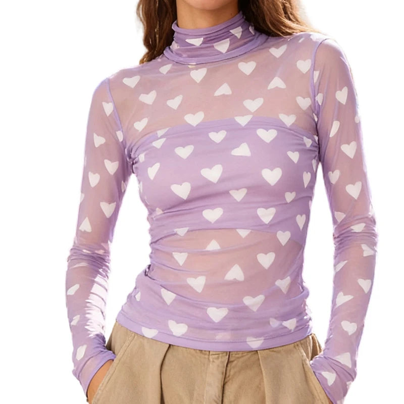 Purple long-sleeve top with white heart patterns 