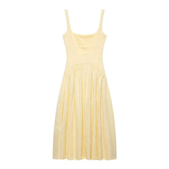 Yellow dress with thin straps on a white background