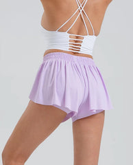 White crop top with thin straps and light purple shorts back view
