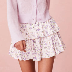Floral tiered skirt worn with a light purple cardigan 