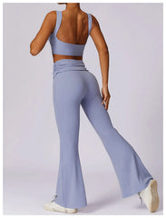 Person wearing a light blue athletic outfit with flared pants