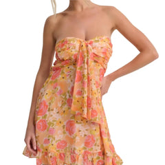 Woman wearing a floral strapless dress 