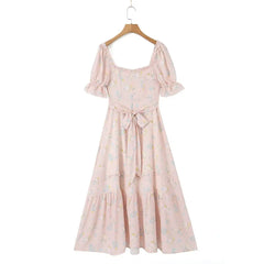 Women's floral dress with puff sleeves and a ruffled hemline.