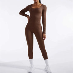 Person wearing a brown bodysuit on a white background