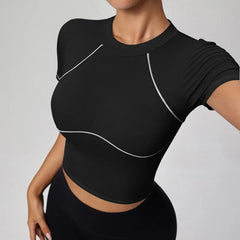 Person wearing a black athletic top with white accents