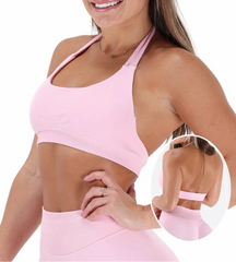 Woman wearing a pink sports bra and leggings with a close-up inset showing the design.