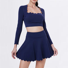 Navy blue two-piece outfit with long-sleeve top and skirt - front view