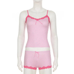 Pink polka dot camisole and shorts set on a mannequin