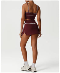 Maroon sports bra and skirt set on a model - full view