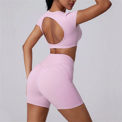 Person wearing a pink athletic outfit on a plain background