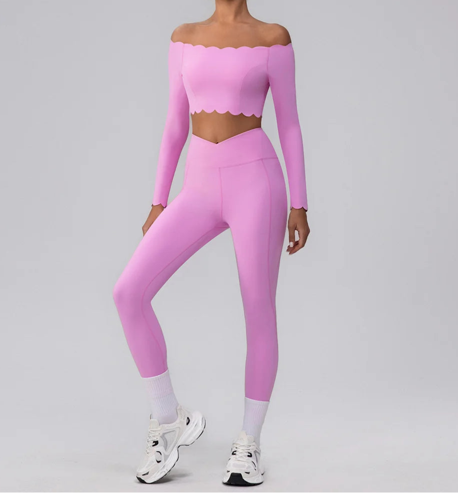 Person wearing a pink long-sleeve top and leggings set