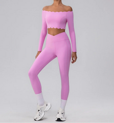 Person wearing a pink long-sleeve top and leggings set