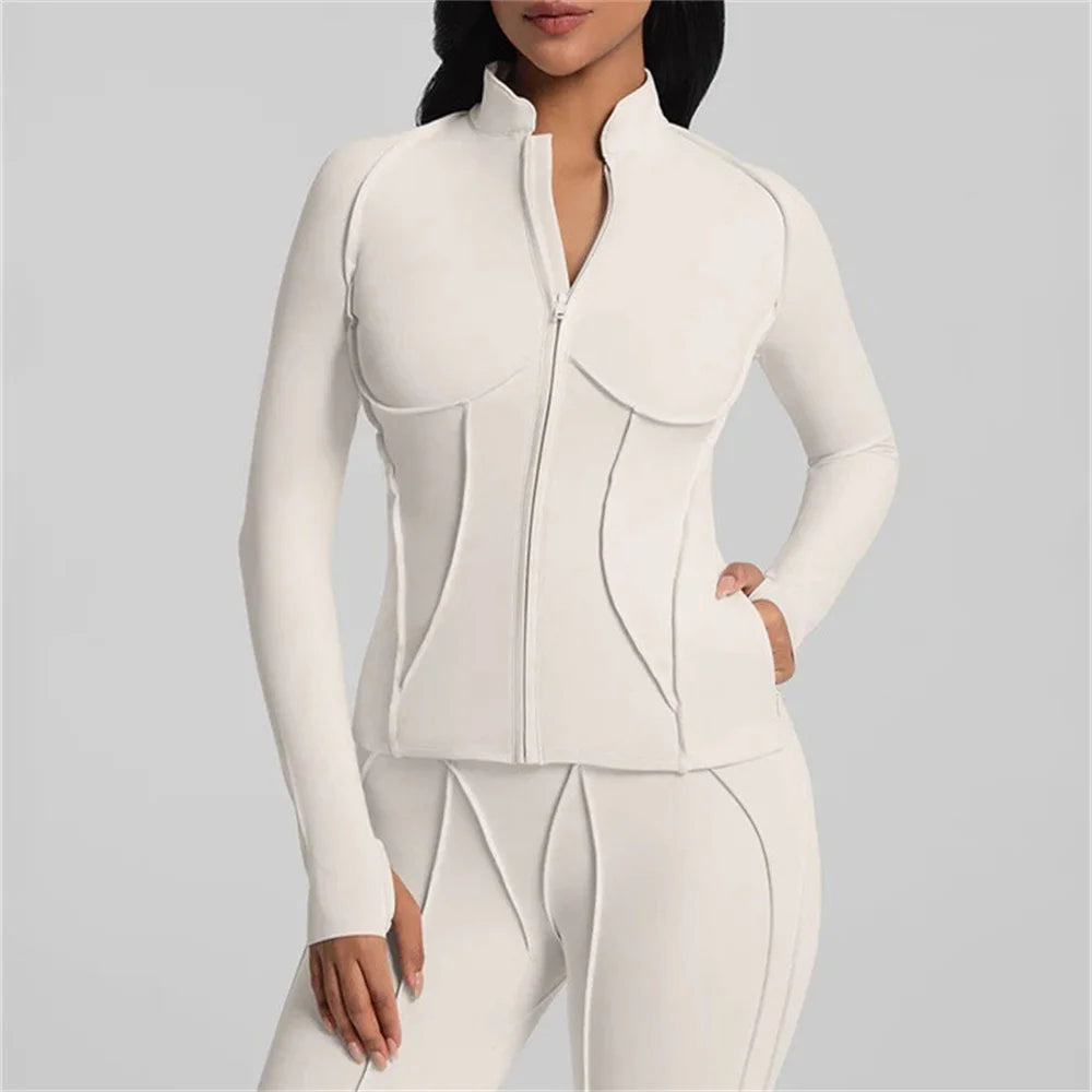 White outfit with a high collar on a gray background