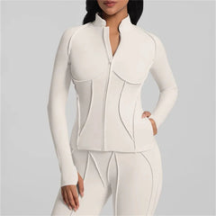 White outfit with a high collar on a gray background