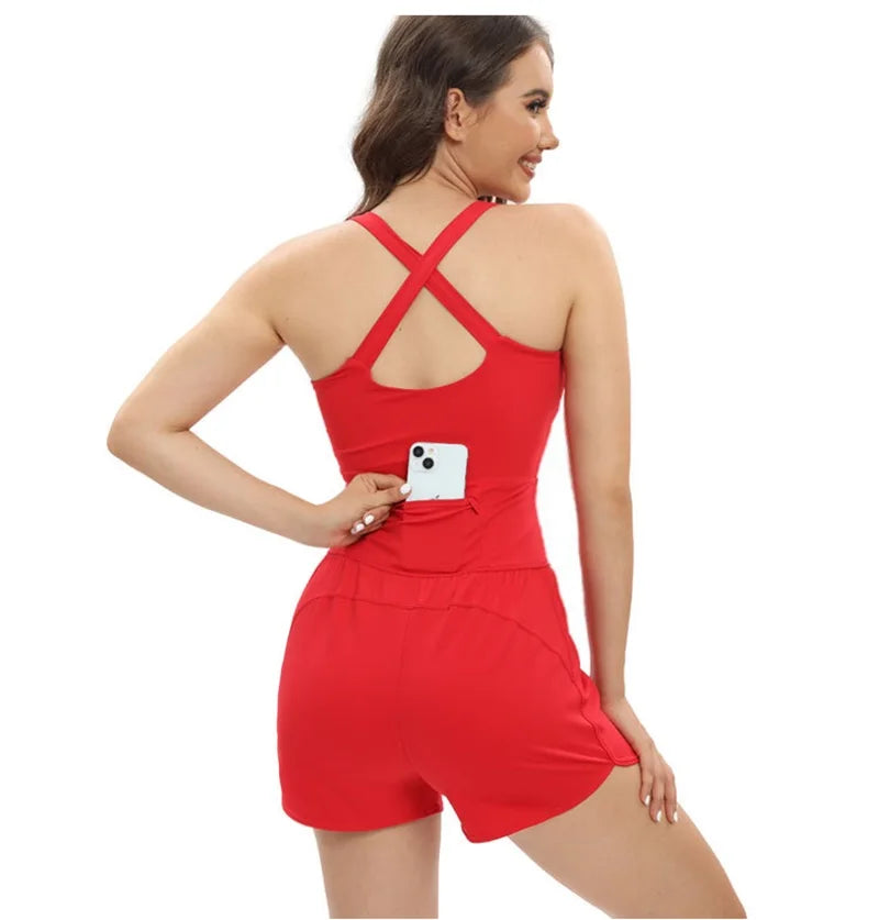 Woman wearing a red romper with a pocket on a white background