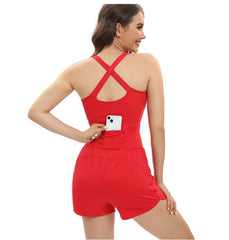 Woman wearing a red romper with a pocket on a white background