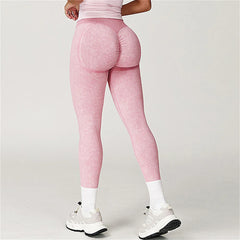 Person wearing pink leggings - back view