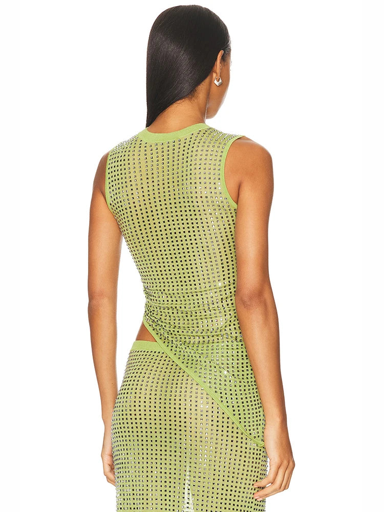 Woman wearing a green mesh outfit  on a white background