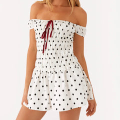 Women's off-shoulder mini dress with polka dots and ruching.