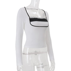 Mannequin wearing a white long-sleeve top with a black bralette 