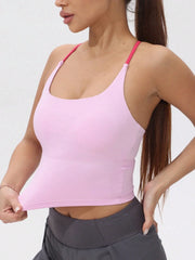 Woman wearing a pink sports bra and gray leggings 