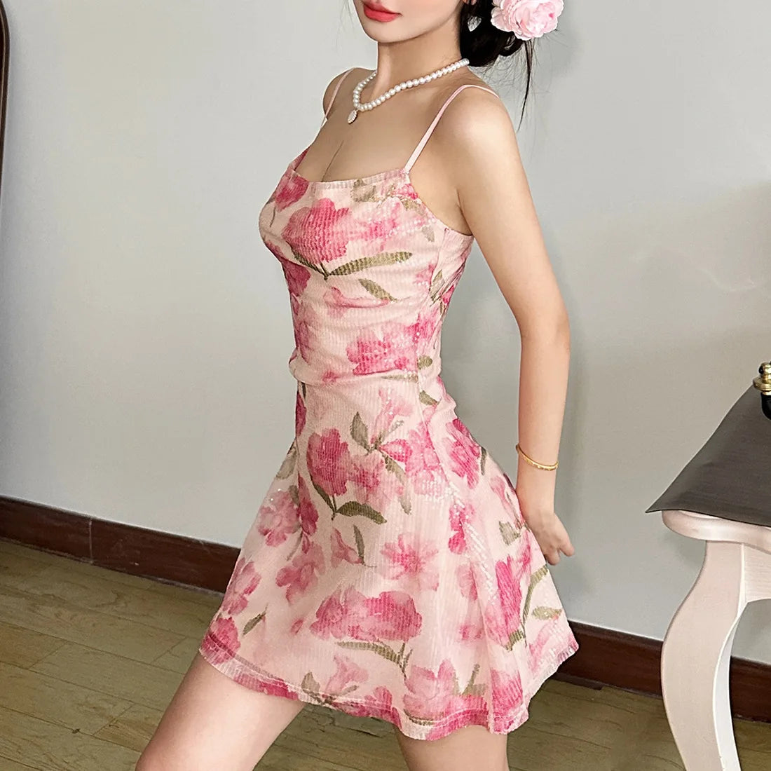 Woman wearing a pink floral dress 