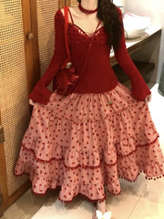 Women's red strawberry print tassel long skirt with tiered ruffles.


