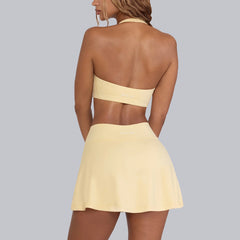 Woman wearing a yellow bikini set- back view