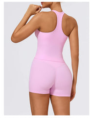 Pink bodysuit worn by a person on a light gray background