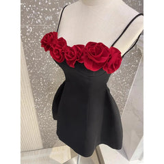 A stylish black mini dress with 3D red flower appliqués and a cami top design.