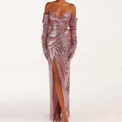 Pink sequin strapless wrap slit midi dress with asymmetrical design and sequin decoration.
