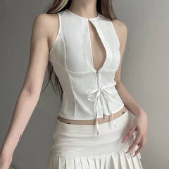 White sleeveless top with a cut-out design on a gray background