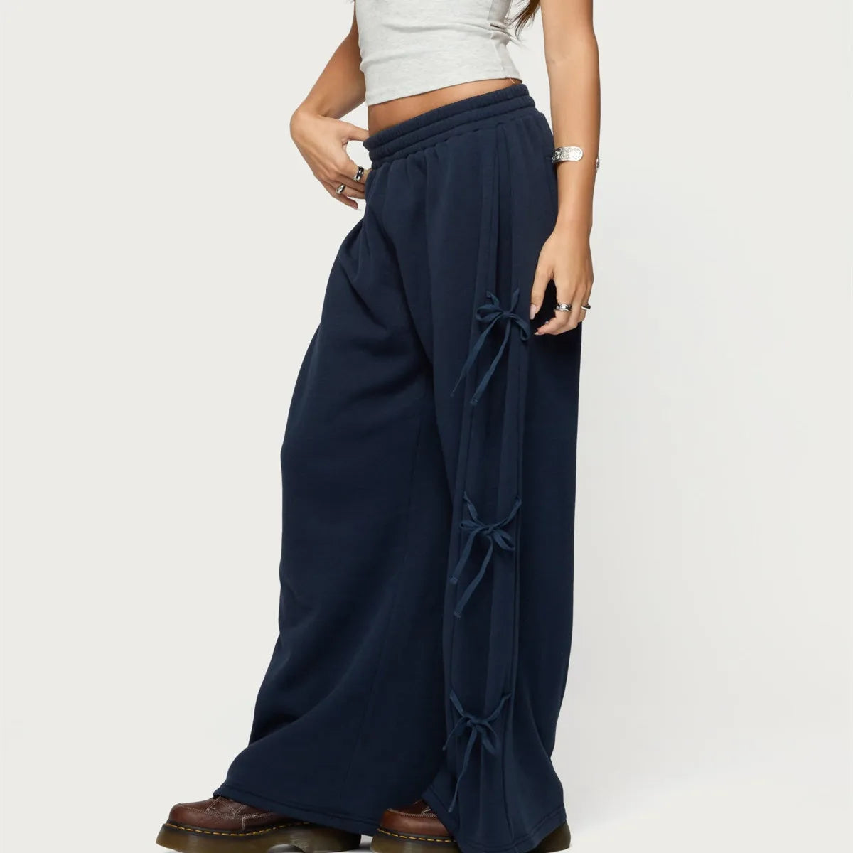 Navy blue wide-leg pants with tied sides worn by a person 