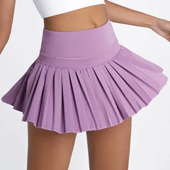 Purple pleated skirt worn by a person - flow details