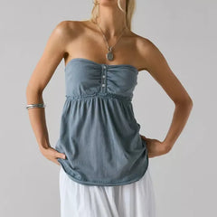 Woman wearing a strapless blue top 