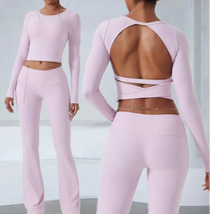 Pink athletic outfit with long-sleeve top and open-back design, shown from front and back.